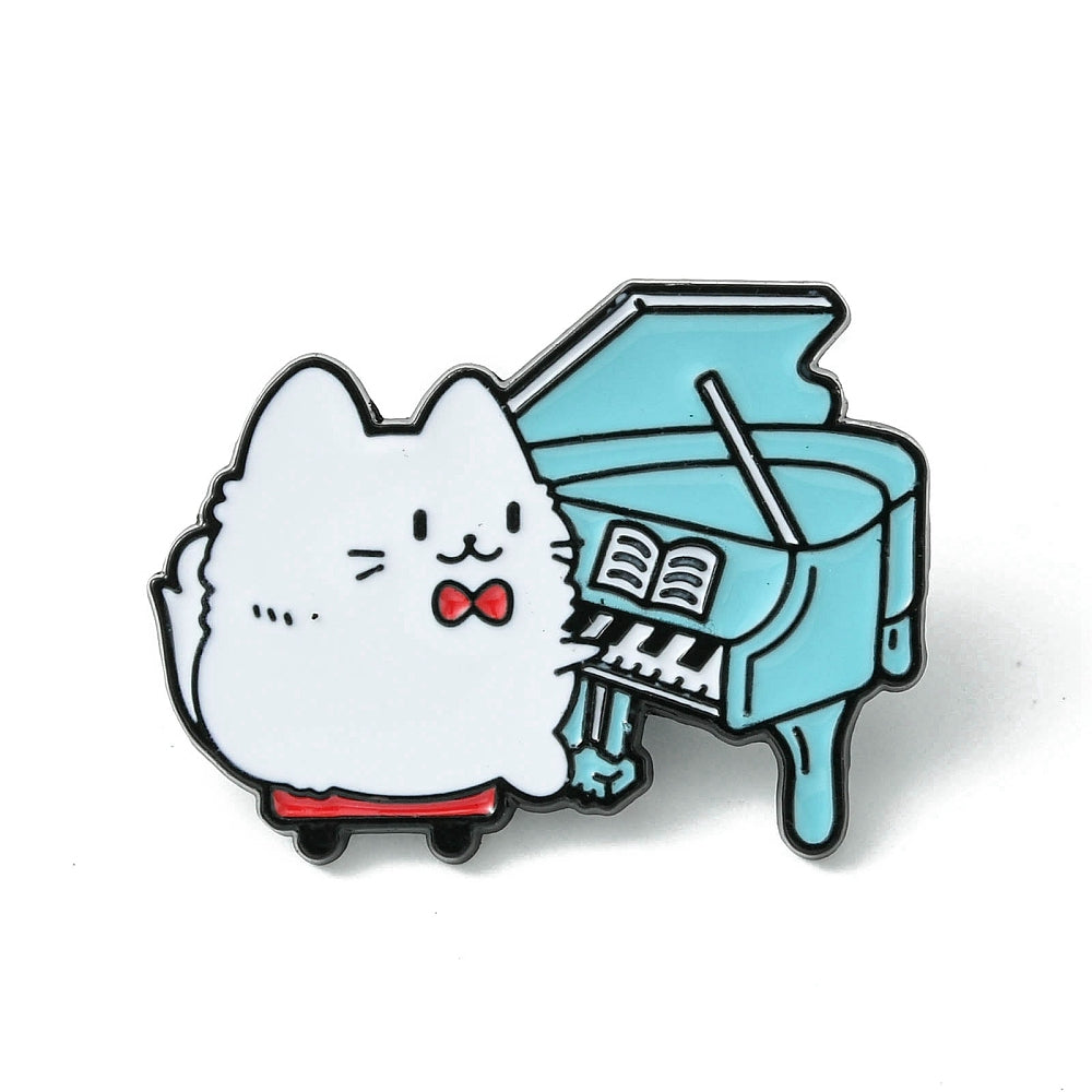 Cat playing piano enamel pin