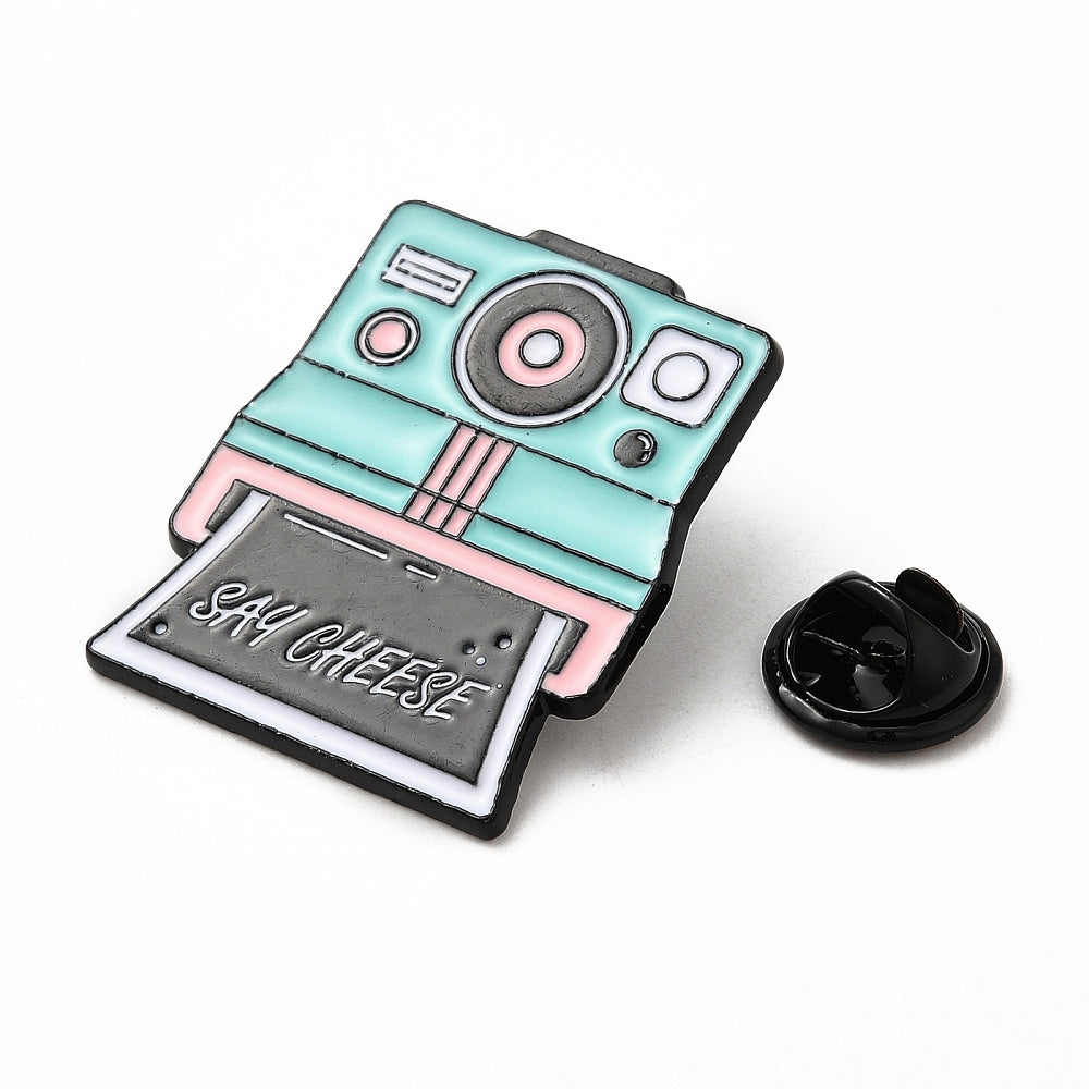 Polaroid camera with 'say cheese' enamel pin