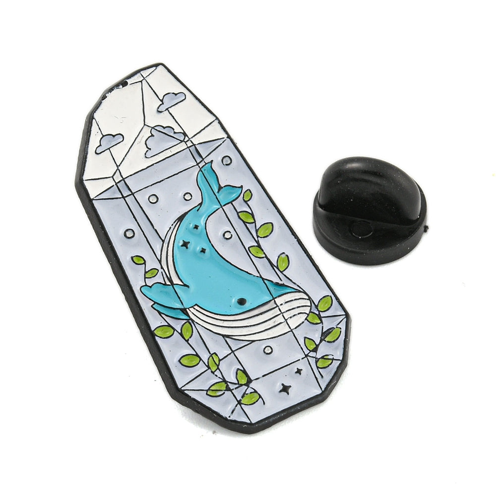 Whale in terrarium enamel pin