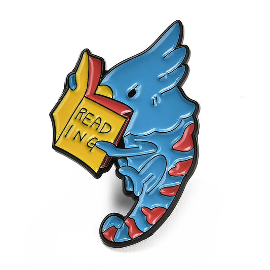 Lizard reading a book enamel pin